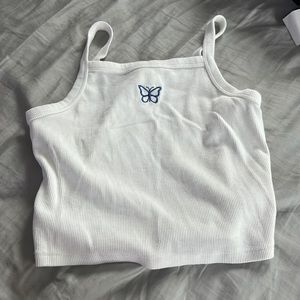this is a cute white cropped tank top with the iconic butterfly 🦋